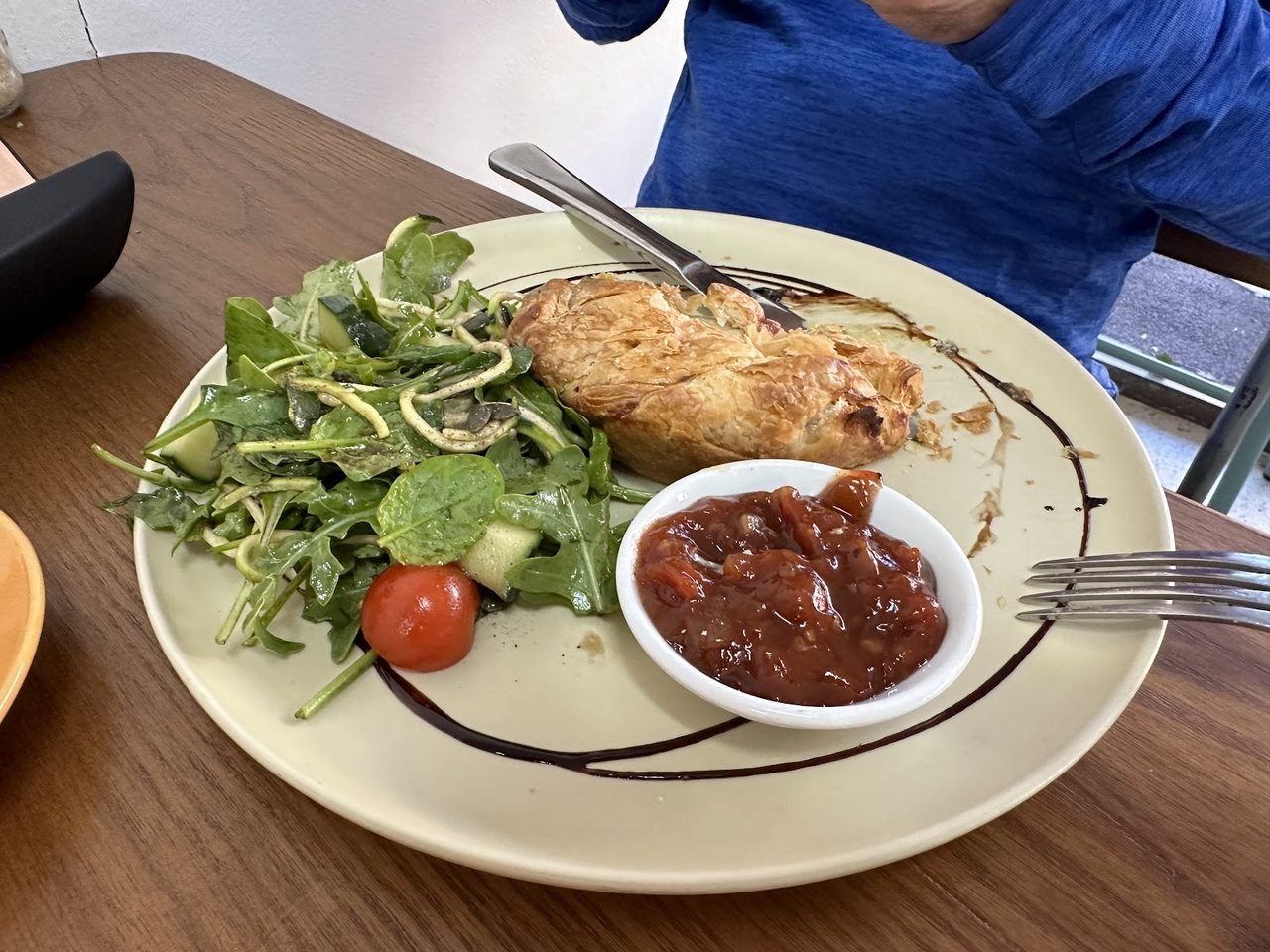 Golden vegan pastry pie served with a rocket salad and house relish.